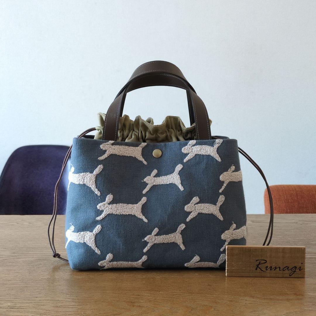 【1569】あおりポケットの巾着バッグ＊ミナペルホネン